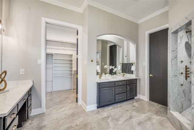 bathroom featuring ornamental molding, vanity, and a tile shower