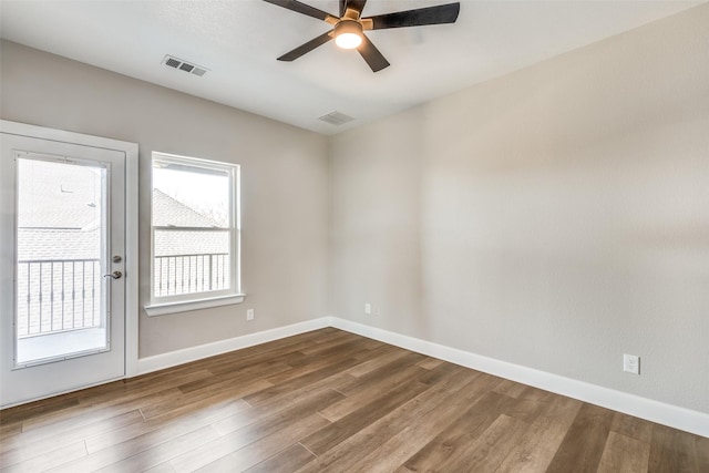 unfurnished room featuring hardwood / wood-style flooring and ceiling fan