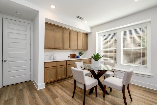 bedroom featuring ceiling fan, baseboards, vaulted ceiling, and light colored carpet