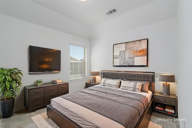 bedroom with light carpet and visible vents