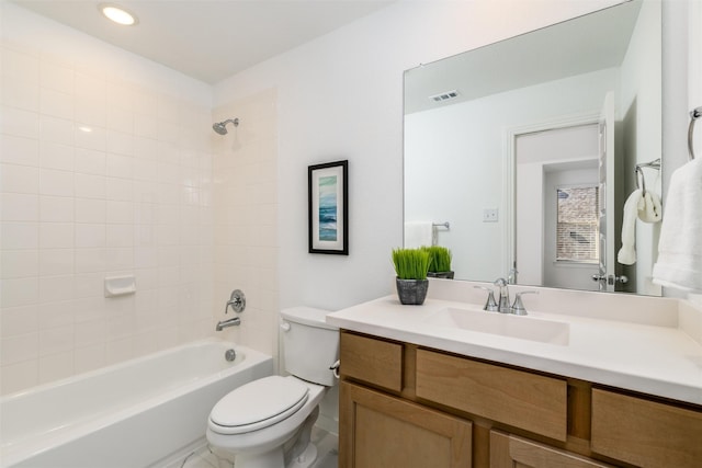 full bathroom featuring toilet, visible vents, shower / washtub combination, and vanity