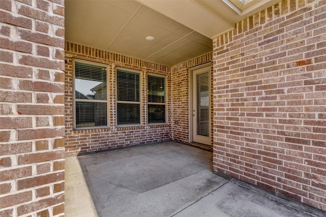 back of property with a yard, a fenced backyard, a shingled roof, and brick siding