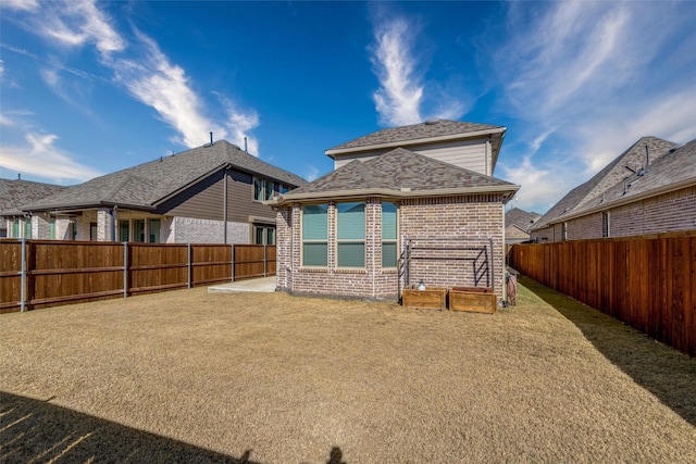 view of yard with a patio area and a fenced backyard