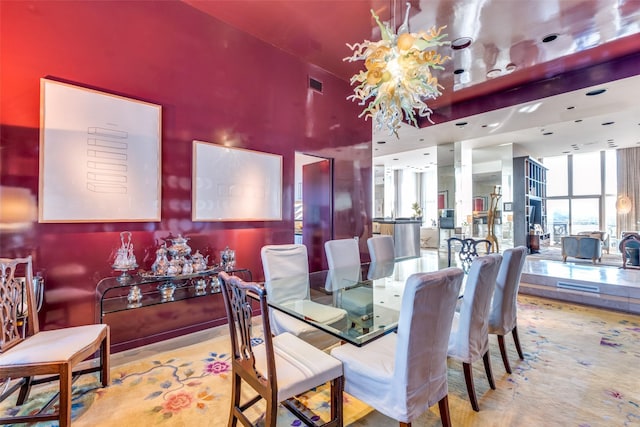 dining area featuring a wall of windows