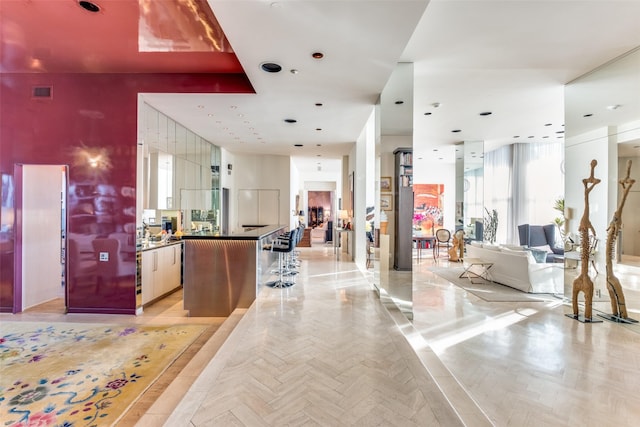 kitchen with a center island and light parquet floors