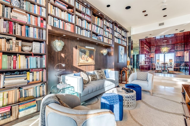 sitting room featuring wood walls