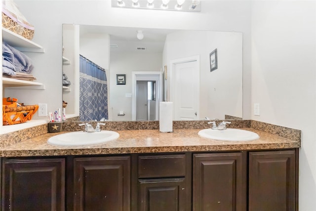 bathroom with vanity and curtained shower