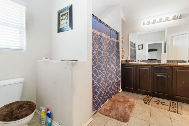 bathroom with vanity, tile patterned floors, toilet, and a shower with shower curtain