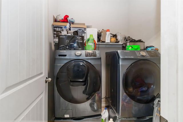 clothes washing area featuring washer and dryer