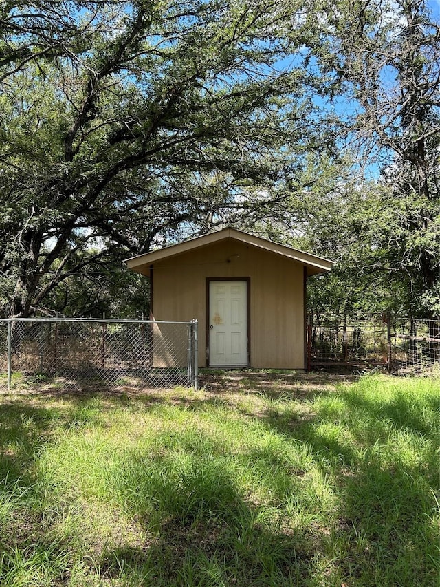 view of outdoor structure with a lawn