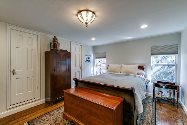 bedroom featuring dark hardwood / wood-style flooring