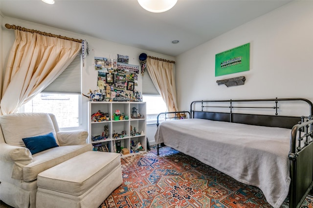 bedroom featuring multiple windows