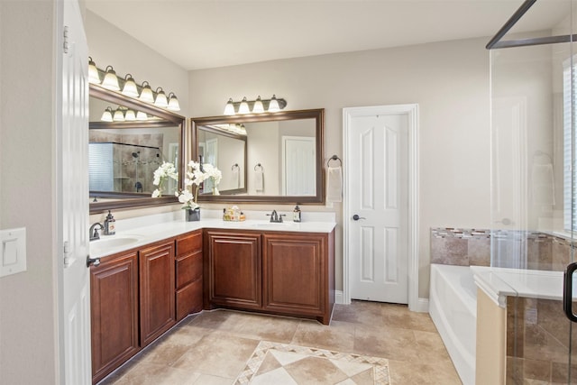 bathroom with vanity and independent shower and bath