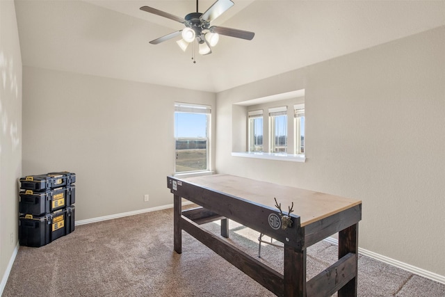 carpeted home office with ceiling fan