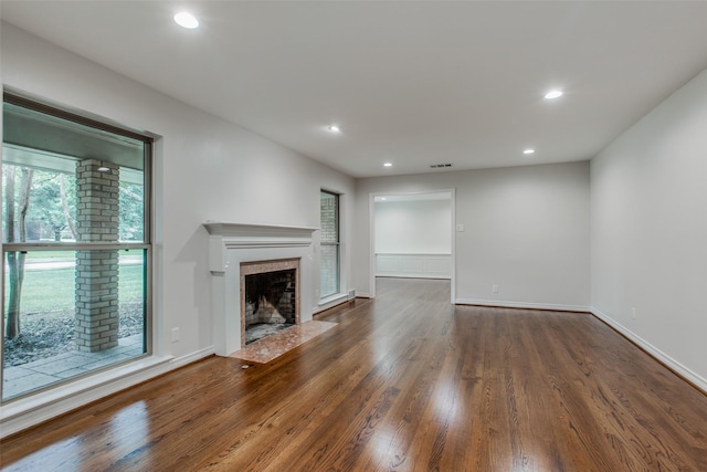 unfurnished living room with dark wood-type flooring