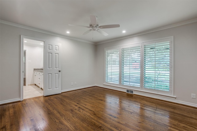 empty room with wood-type flooring, ornamental molding, and ceiling fan