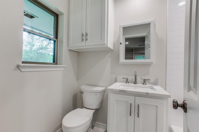 bathroom featuring vanity and toilet