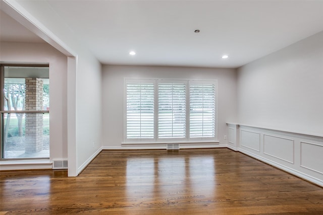 empty room featuring dark hardwood / wood-style floors