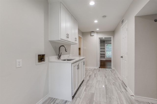 kitchen with sink and white cabinets