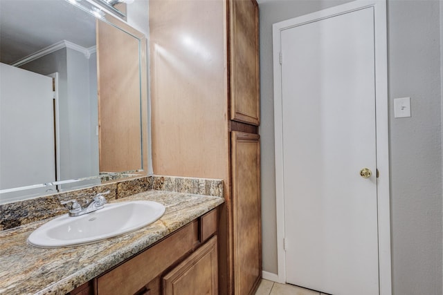 bathroom with vanity, tile patterned floors, and crown molding