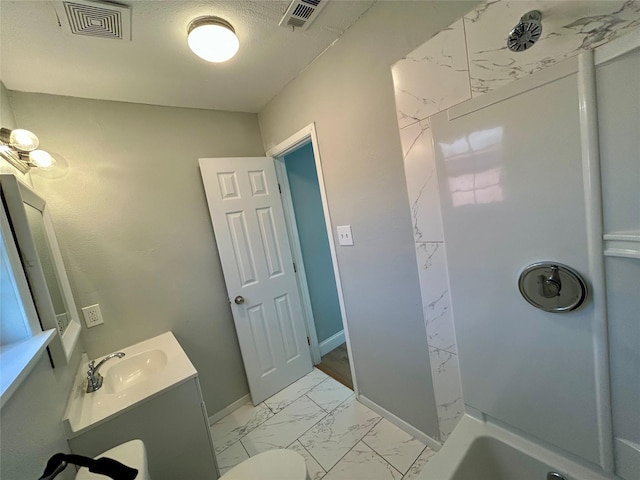 bathroom featuring vanity and a textured ceiling