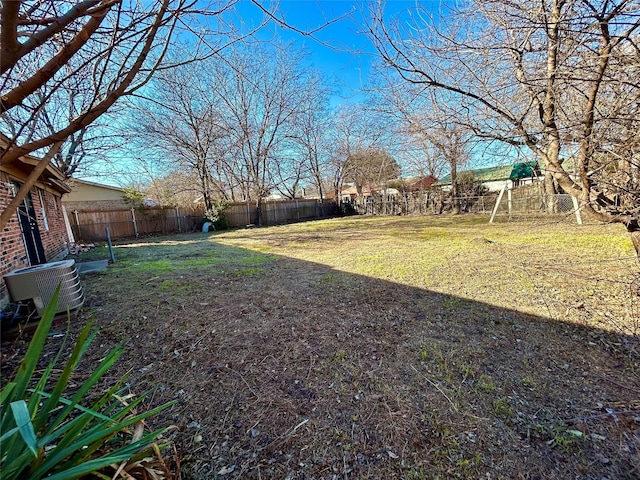 view of yard with central AC unit