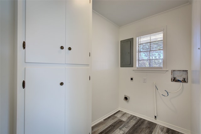 clothes washing area featuring dark hardwood / wood-style floors, washer hookup, electric panel, crown molding, and electric dryer hookup