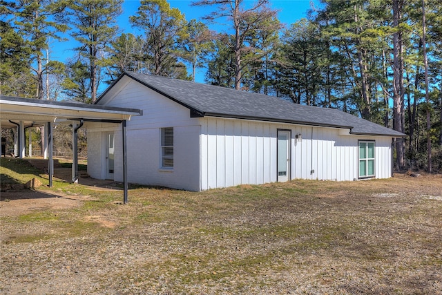 view of side of property with a yard