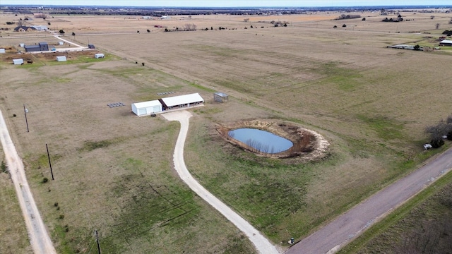 drone / aerial view with a rural view and a water view