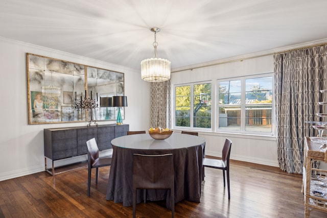 dining space with crown molding, dark hardwood / wood-style floors, and a notable chandelier