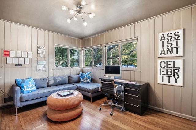 home office with wood-type flooring, visible vents, and a notable chandelier