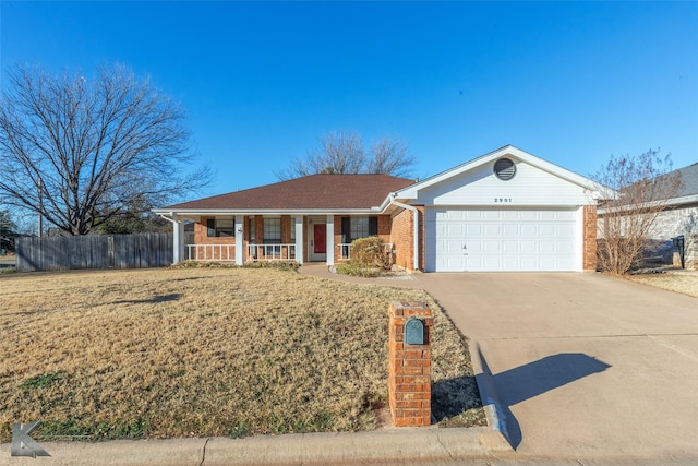 ranch-style house with a porch, a garage, and a front lawn