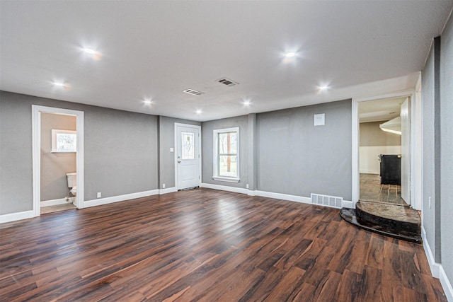 unfurnished room featuring dark hardwood / wood-style floors