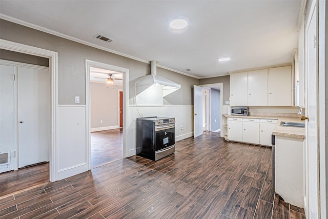 kitchen with stainless steel appliances, white cabinetry, ornamental molding, and sink