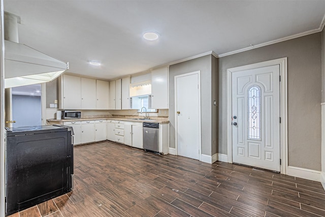 kitchen with appliances with stainless steel finishes, white cabinetry, sink, crown molding, and wall chimney exhaust hood