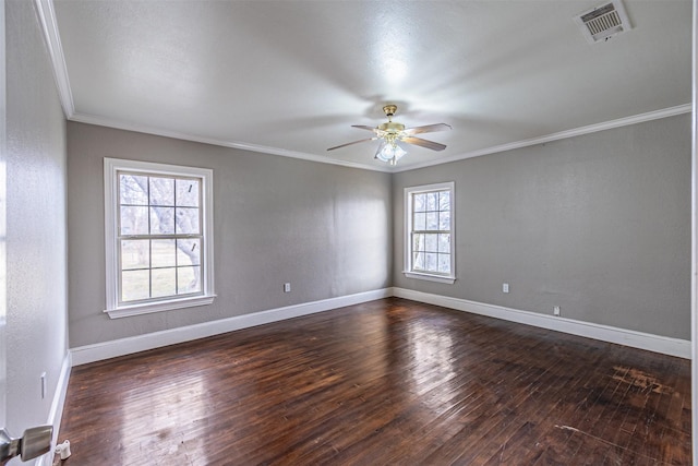 spare room with dark hardwood / wood-style flooring, ornamental molding, and ceiling fan