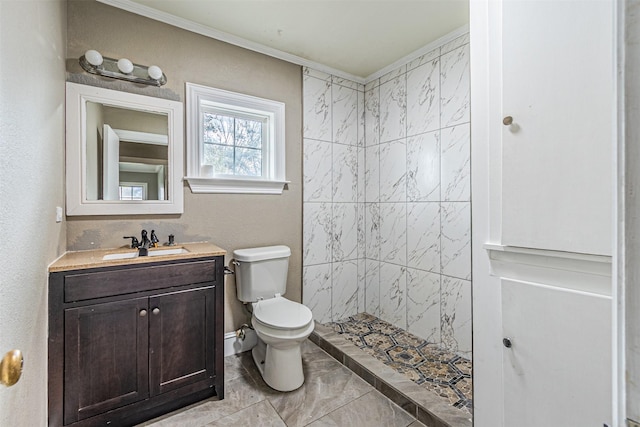 bathroom featuring vanity, crown molding, toilet, and walk in shower