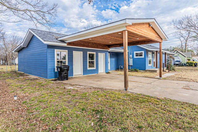 rear view of property with a yard