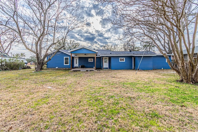 ranch-style home featuring a front yard