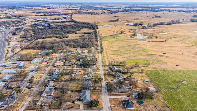 birds eye view of property featuring a rural view