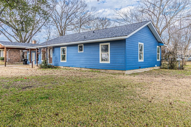 back of property featuring a yard