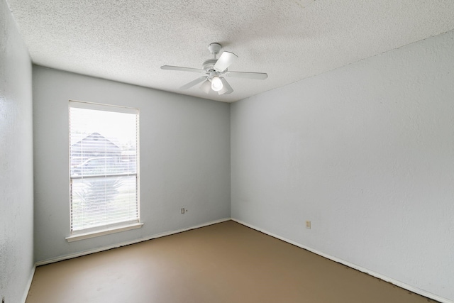 empty room featuring a textured ceiling and ceiling fan