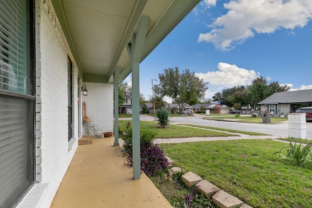 view of yard featuring covered porch