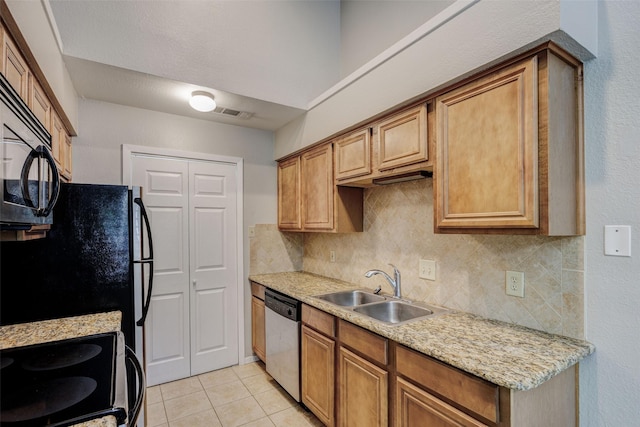 kitchen with light tile patterned flooring, electric range oven, refrigerator, dishwasher, and sink