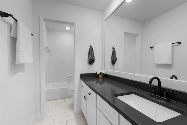 bathroom featuring bathing tub / shower combination, vanity, toilet, and tile patterned floors