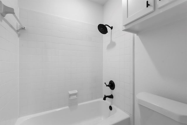 bathroom with toilet and shower / bathing tub combination