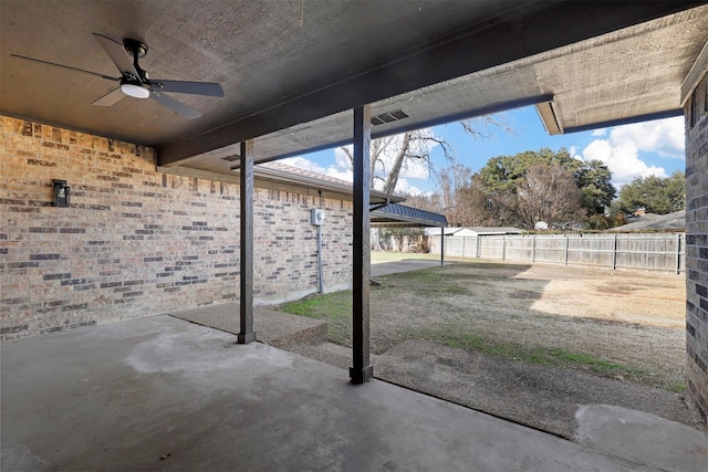 view of patio with a fenced backyard and ceiling fan