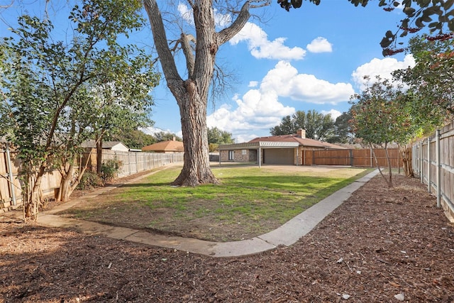 view of yard featuring a patio and a fenced backyard