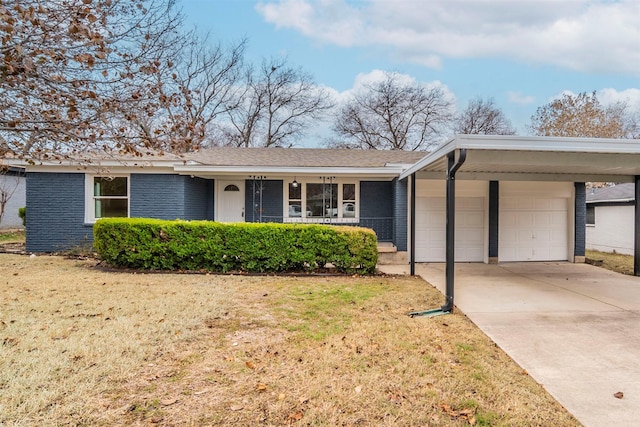 ranch-style house featuring a carport, a garage, and a front yard