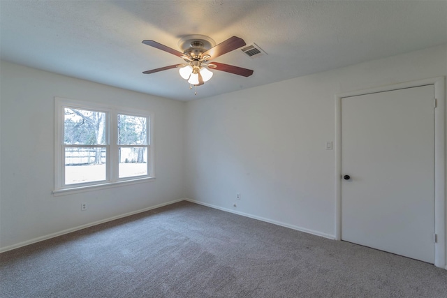 carpeted empty room with ceiling fan